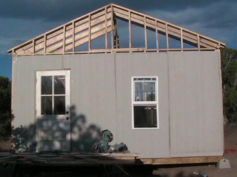 A building with a roof that is being built.