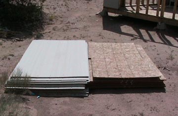 A pile of tile sitting on top of the ground.