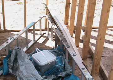 A white cooler sitting on top of some wood.